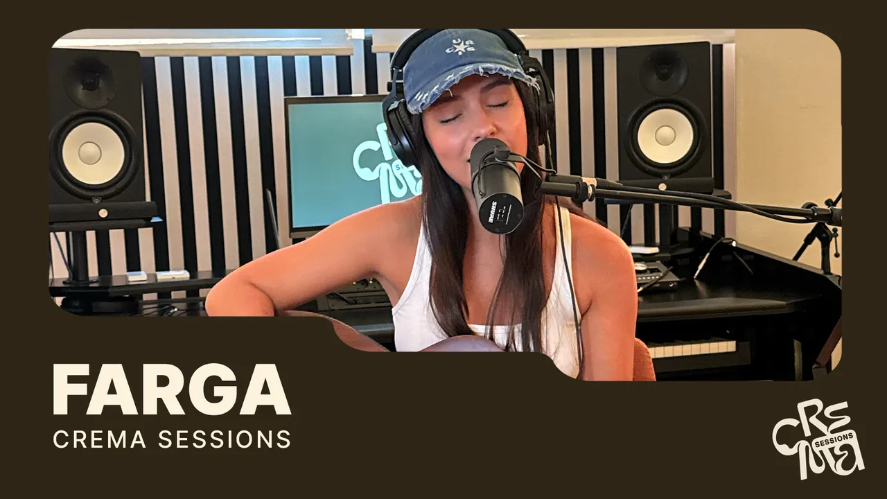 FARGA singing with an acoustic guitar in the CREMA Studio room
